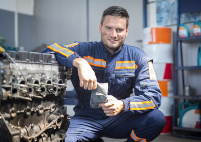 Professional car mechanic in repair shop.