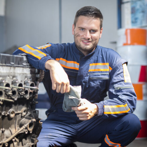 Professional car mechanic in repair shop.